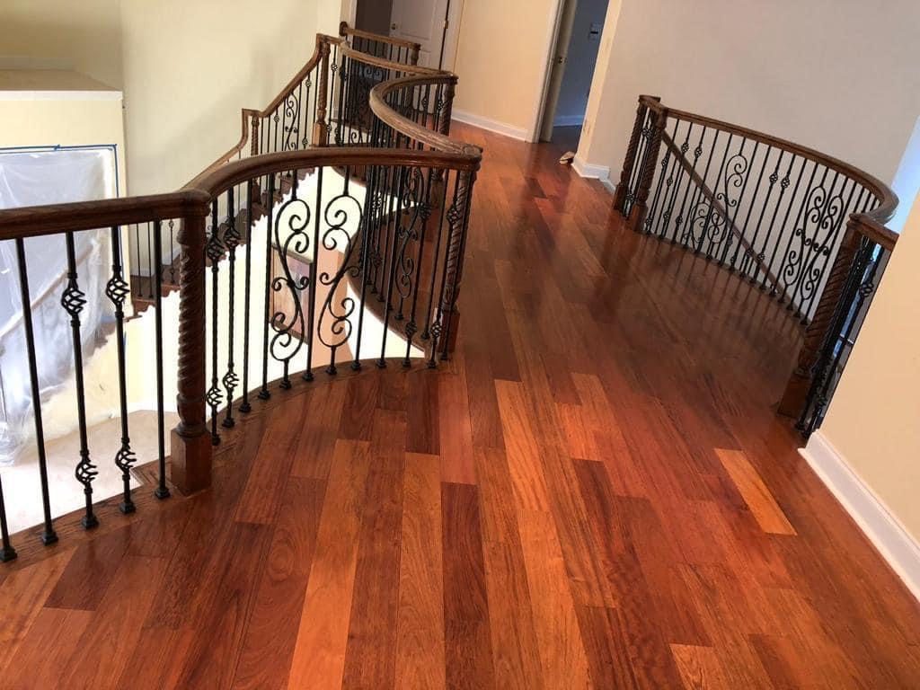 Cherry hardwood landing with curved staircase